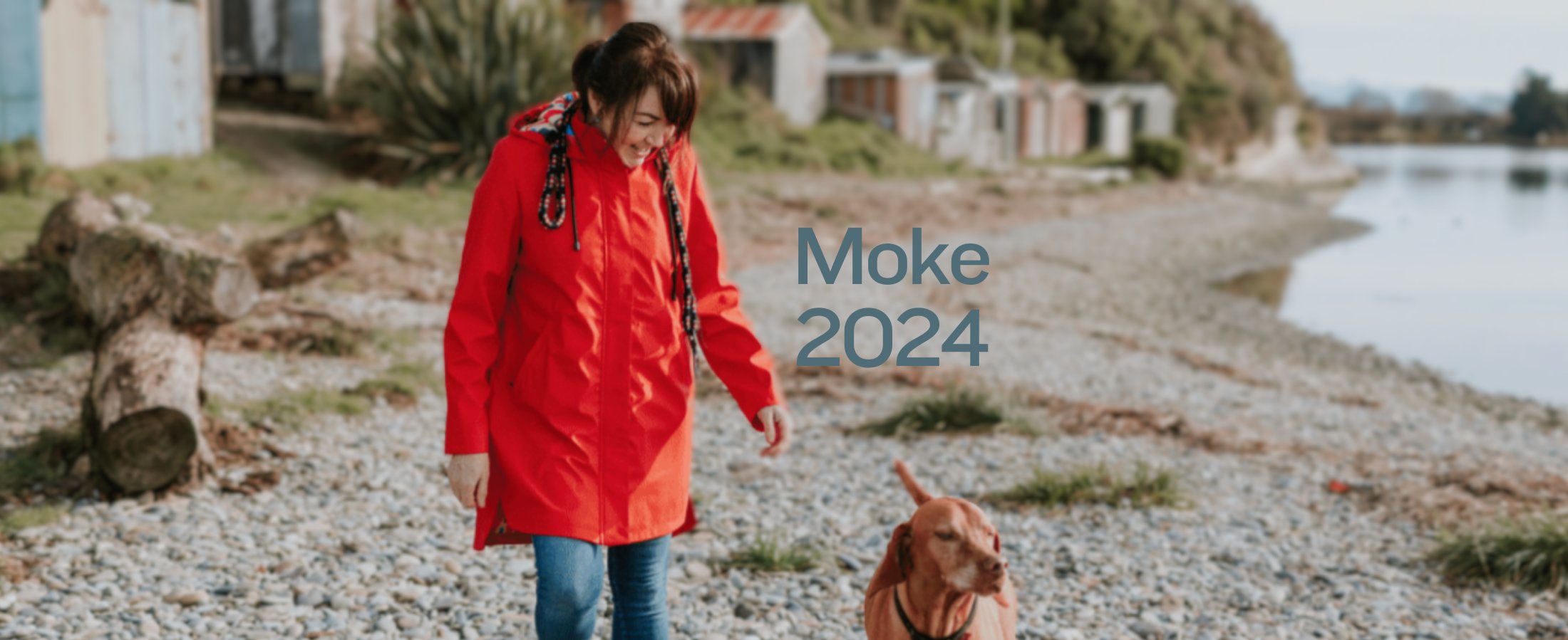 Womens walking along the water's edge wearing a puffer vest from Moke Apparel